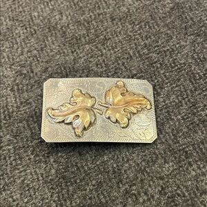 Vgt Ricardo nickel silver and bronze oak leaf western belt buckle.
